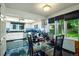 Bright eat-in kitchen with black tile floors, white cabinets, and an outdoor view at 4505 S Yosemite St # 125, Denver, CO 80237