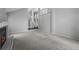 Bright and spacious living room with a fireplace, neutral carpet, and a view of the foyer at 4505 S Yosemite St # 125, Denver, CO 80237