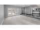 Spacious living room featuring plush carpeting and French doors leading to an outdoor area at 4505 S Yosemite St # 125, Denver, CO 80237