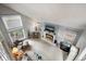 Bright living room with a fireplace, large windows, and comfortable seating at 4505 S Yosemite St # 125, Denver, CO 80237