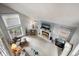 Aerial view of a comfortable living room with fireplace and lots of windows at 4505 S Yosemite St # 125, Denver, CO 80237