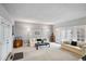 Comfortable living room with neutral tones, carpeting and natural light at 4505 S Yosemite St # 125, Denver, CO 80237