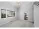 Bright living room with neutral carpet, and a view into the adjacent kitchen at 4505 S Yosemite St # 125, Denver, CO 80237