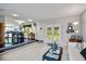 Open-concept living area with outdoor access, wine rack, and bright light at 4505 S Yosemite St # 125, Denver, CO 80237