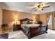 Main bedroom featuring a ceiling fan, soft carpet, and stylish furnishings at 4505 S Yosemite St # 125, Denver, CO 80237