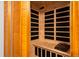 Interior view of a wooden sauna with bench seating and temperature controls at 4505 S Yosemite St # 125, Denver, CO 80237