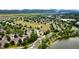 Serene aerial view of the neighborhood and surrounding lake at 8410 S Oak St, Littleton, CO 80127