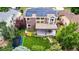 Aerial view of the home featuring a solar panel roof and a pergola-covered patio at 8410 S Oak St, Littleton, CO 80127