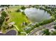 Aerial view of the community with a park, playground and green space near the lake at 8410 S Oak St, Littleton, CO 80127