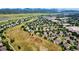Aerial view of neighborhood with wide-open spaces and picturesque mountain views at 8410 S Oak St, Littleton, CO 80127