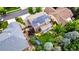Aerial view of home showcasing the solar panels on the roof and beautifully landscaped yard at 8410 S Oak St, Littleton, CO 80127