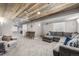 Finished basement featuring rustic wood ceiling, bar seating, and comfortable gray sectional sofa at 8410 S Oak St, Littleton, CO 80127