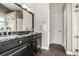 Elegant bathroom featuring a double sink vanity with granite countertop and tiled floors at 8410 S Oak St, Littleton, CO 80127