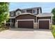 Charming home with a two-car garage and a well-maintained exterior at 8410 S Oak St, Littleton, CO 80127