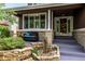 Inviting front porch with brick accents and a cozy seating area at 8410 S Oak St, Littleton, CO 80127