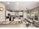 Spacious kitchen with white cabinetry, granite countertops, and stainless steel appliances at 8410 S Oak St, Littleton, CO 80127