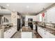 Modern kitchen with white cabinets, black appliances, and granite countertops at 8410 S Oak St, Littleton, CO 80127