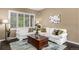 Cozy living room with large windows and comfortable seating arrangement at 8410 S Oak St, Littleton, CO 80127