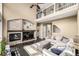 Spacious living room with a fireplace, media center, and open layout at 8410 S Oak St, Littleton, CO 80127