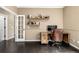 Home office with desk and shelves, a door to another room at 8410 S Oak St, Littleton, CO 80127