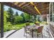 Relaxing outdoor patio under a pergola with an inviting outdoor dining set at 8410 S Oak St, Littleton, CO 80127