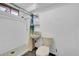 Basement bathroom with shower, toilet, and sink at 130 S Eaton St, Lakewood, CO 80226