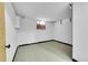 Unfinished basement bedroom with window and flooring at 130 S Eaton St, Lakewood, CO 80226