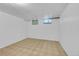 Unfinished basement room with two windows at 130 S Eaton St, Lakewood, CO 80226