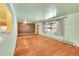 Living room features brown carpet and light-green walls at 130 S Eaton St, Lakewood, CO 80226