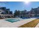 Community pool covered for the off-season, surrounded by townhouses and picnic areas at 5250 S Huron Way # 11-206, Littleton, CO 80120