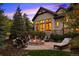 Cozy fire pit and seating area on a flagstone patio at 2198 Avenida Del Sol, Castle Rock, CO 80104