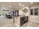 Basement wet bar with a wine cooler, microwave, and seating at 2198 Avenida Del Sol, Castle Rock, CO 80104
