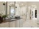 Elegant bathroom with a large shower, double vanity, and marble countertops at 2198 Avenida Del Sol, Castle Rock, CO 80104
