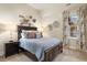Cozy bedroom with a double bed, window seat, and unique wall art at 2198 Avenida Del Sol, Castle Rock, CO 80104