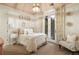 Charming bedroom with a queen bed, French doors to balcony, and soft decor at 2198 Avenida Del Sol, Castle Rock, CO 80104