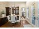 Breakfast nook with stone accent wall and custom cabinetry at 2198 Avenida Del Sol, Castle Rock, CO 80104