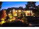 Luxury home exterior at night, beautifully illuminated at 2198 Avenida Del Sol, Castle Rock, CO 80104