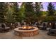 Large fire pit surrounded by comfortable seating in a spacious backyard at 2198 Avenida Del Sol, Castle Rock, CO 80104