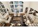 Open concept living space with high ceilings, fireplace and lots of natural light at 2198 Avenida Del Sol, Castle Rock, CO 80104