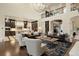 Spacious living area with hardwood floors, a fireplace and open kitchen at 2198 Avenida Del Sol, Castle Rock, CO 80104