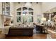 Open living area with high ceilings, fireplace, and large windows at 2198 Avenida Del Sol, Castle Rock, CO 80104
