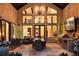 Covered patio with outdoor kitchen, fireplace, and comfortable seating at 2198 Avenida Del Sol, Castle Rock, CO 80104