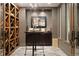 Impressive wine cellar featuring custom wooden racks and ample storage at 2198 Avenida Del Sol, Castle Rock, CO 80104