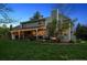 Expansive backyard featuring a covered patio, outdoor kitchen, and a cozy fire pit area, ideal for gatherings at 2187 Wynterbrook Dr, Highlands Ranch, CO 80126