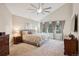 Spacious bedroom with a ceiling fan, large windows, and neutral decor at 2187 Wynterbrook Dr, Highlands Ranch, CO 80126
