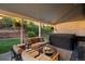 Cozy covered patio with comfortable seating and hot tub perfect for relaxing outdoors at 2187 Wynterbrook Dr, Highlands Ranch, CO 80126