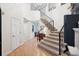 Grand foyer featuring a staircase, high ceilings, and hardwood floors at 2187 Wynterbrook Dr, Highlands Ranch, CO 80126