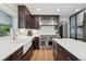 Modern kitchen featuring wooden cabinets, stainless steel appliances, and bright countertops at 2187 Wynterbrook Dr, Highlands Ranch, CO 80126