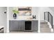 Stylish bar area with wine fridge, gray cabinetry, and contemporary decor at 2435 S High St, Denver, CO 80210