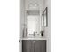 Well-lit bathroom features modern sink, framed mirror, a clean, contemporary design, and neutral color palette at 2435 S High St, Denver, CO 80210